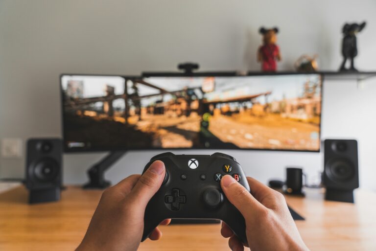 person hold black game controller