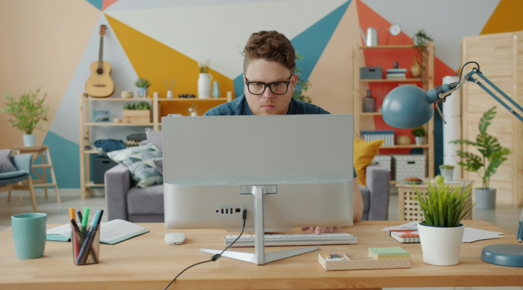 a guy is working on a computer