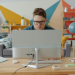 a guy is working on a computer